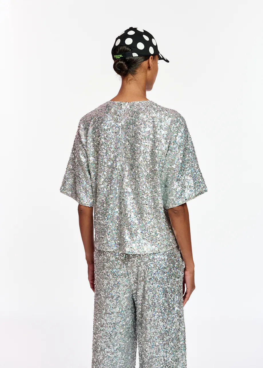 Model wears boxy silver sequined t-shirt 
