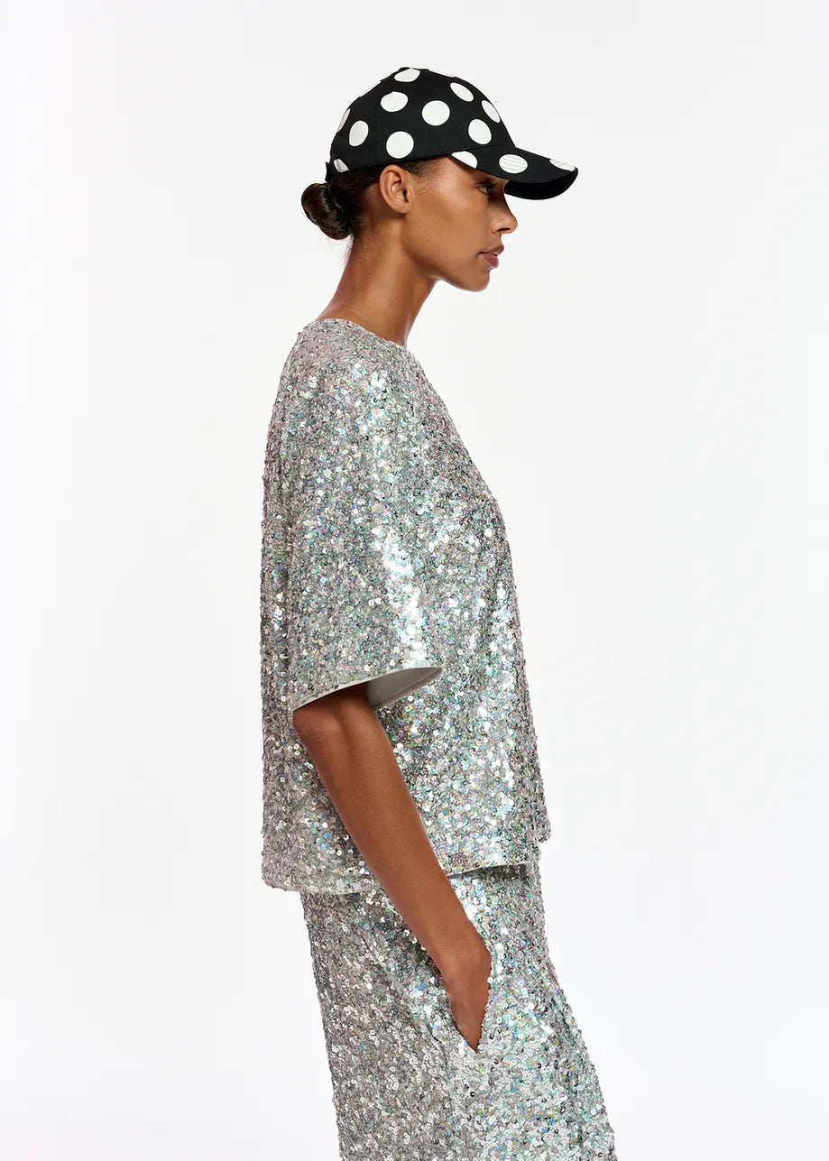 Model wears boxy silver sequined t-shirt 
