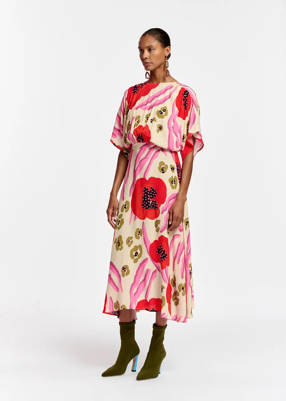 Model wears 3/4 length midi dress with floral poppy pattern