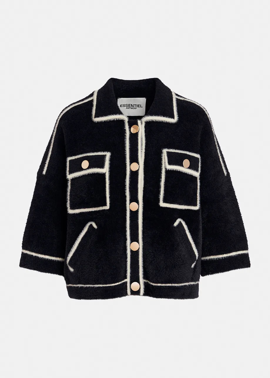 The Galena Cardigan - Black & White by Essentiel Antwerp is a black wool jacket with white piping, featuring a collar, long sleeves, two chest pockets with flap closures, two side pockets, and a front button closure with gold-tone buttons.