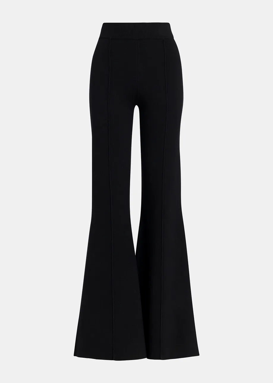 The Gattitude Knit Trousers - Black by Essentiel Antwerp feature a high-waisted, flared design with vertical seams, made from stretchy knit material for a close fit, and are showcased on a plain background.