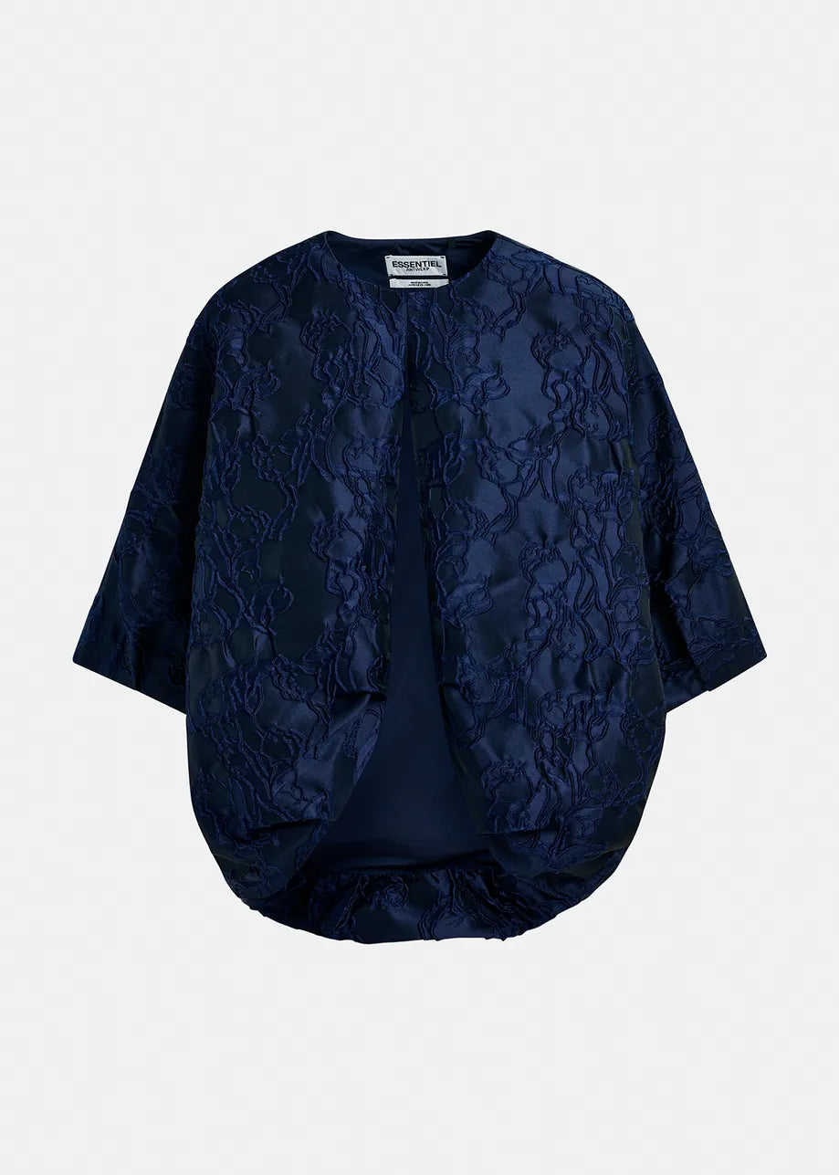 The Essentiel Antwerp Genuine Jacquard Jacket in navy features short sleeves, an open front, and a luxurious textured floral pattern.