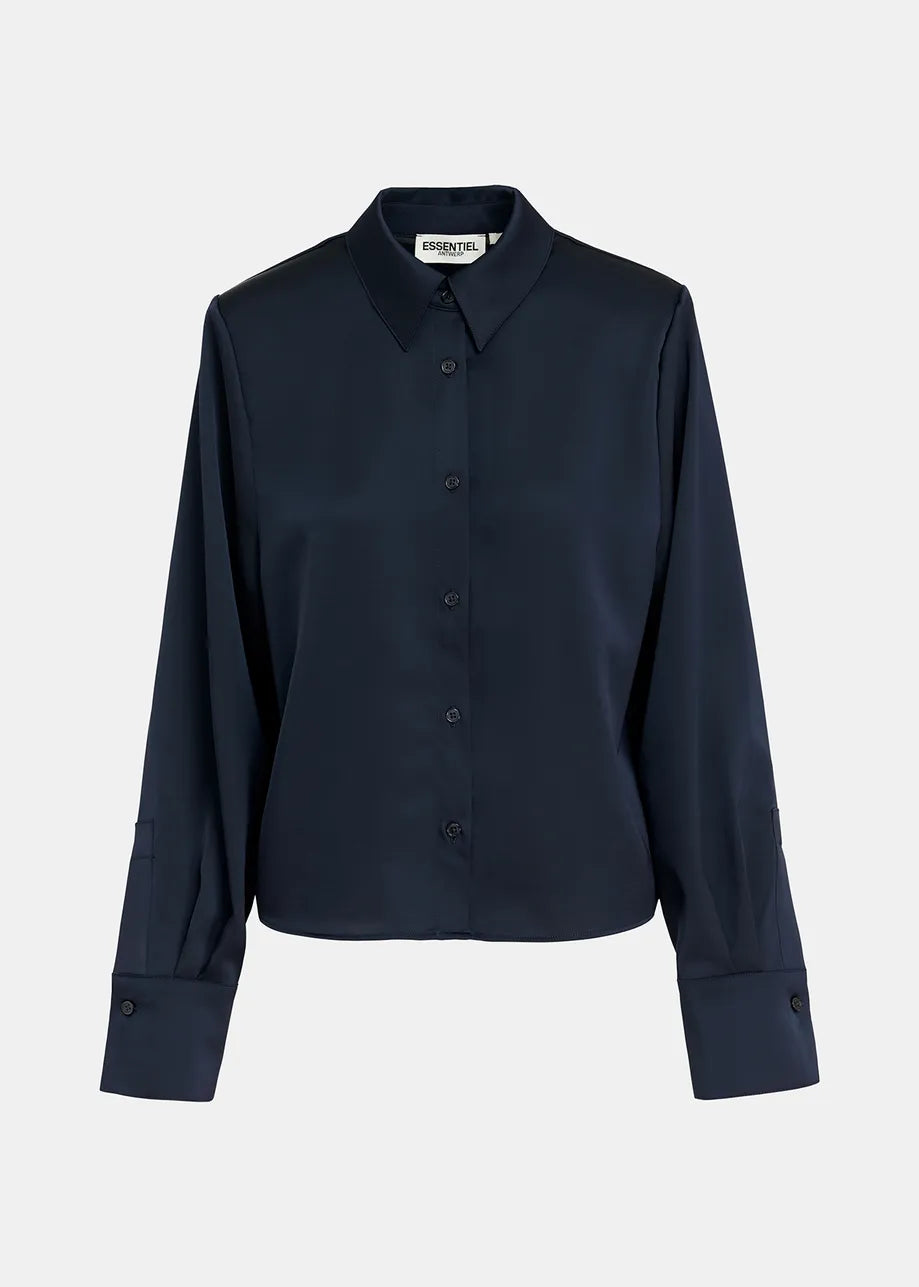 This image shows the Genvieve Satin Shirt from Essentiel Antwerp, featuring a relaxed fit, long sleeves, and a button-down design with a collar in navy. Crafted from smooth recycled polyester fabric.