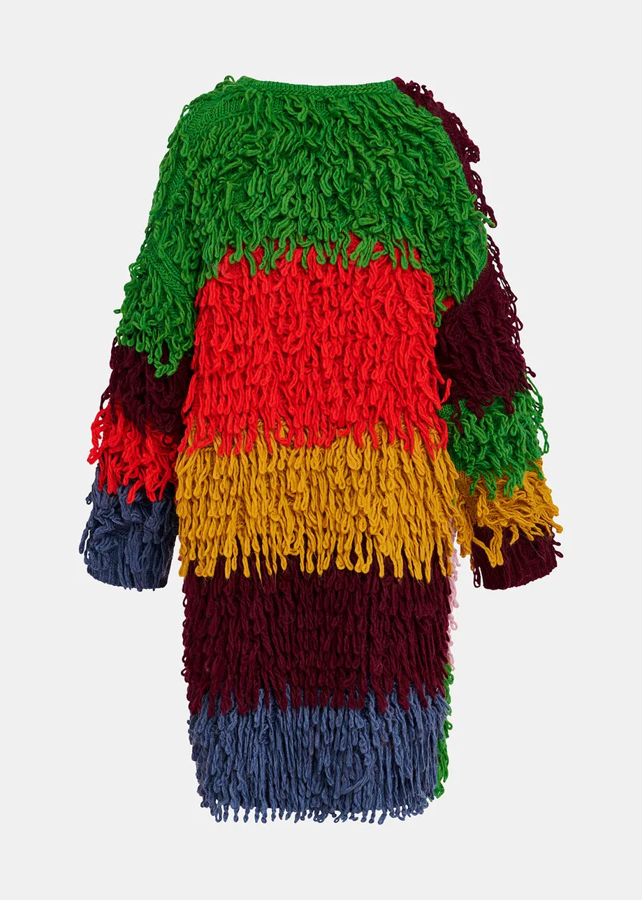 The Gingle Oversized Knit - Multicolour by Essentiel Antwerp is a vibrant, long-sleeve shaggy sweater showcasing green, red, yellow, blue, and burgundy stripes. This versatile piece features an oversized outerwear design with a distinctive loop-stitch knit for added texture and flair.