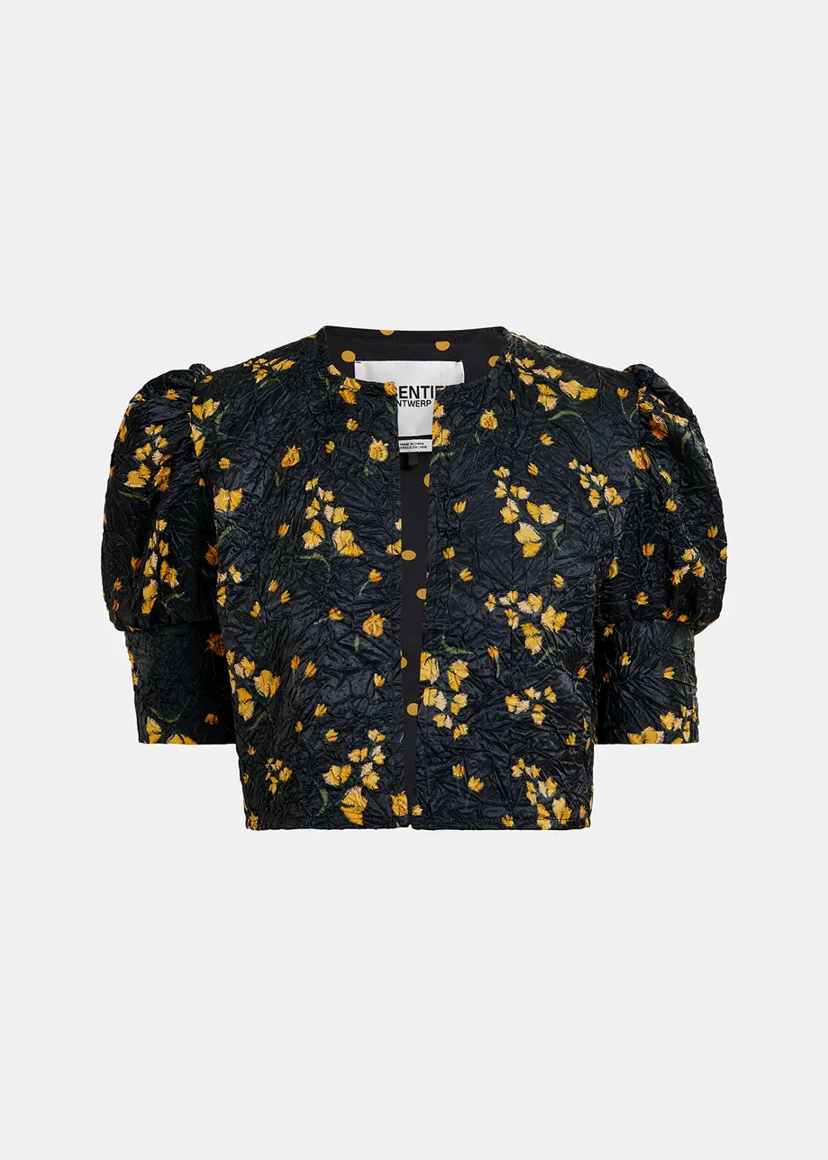 Essentiel Antwerp's Hosha Cropped Jacket is oversized, black, with a yellow floral pattern; features short puffed sleeves and a round neckline; made from recycled polyester.