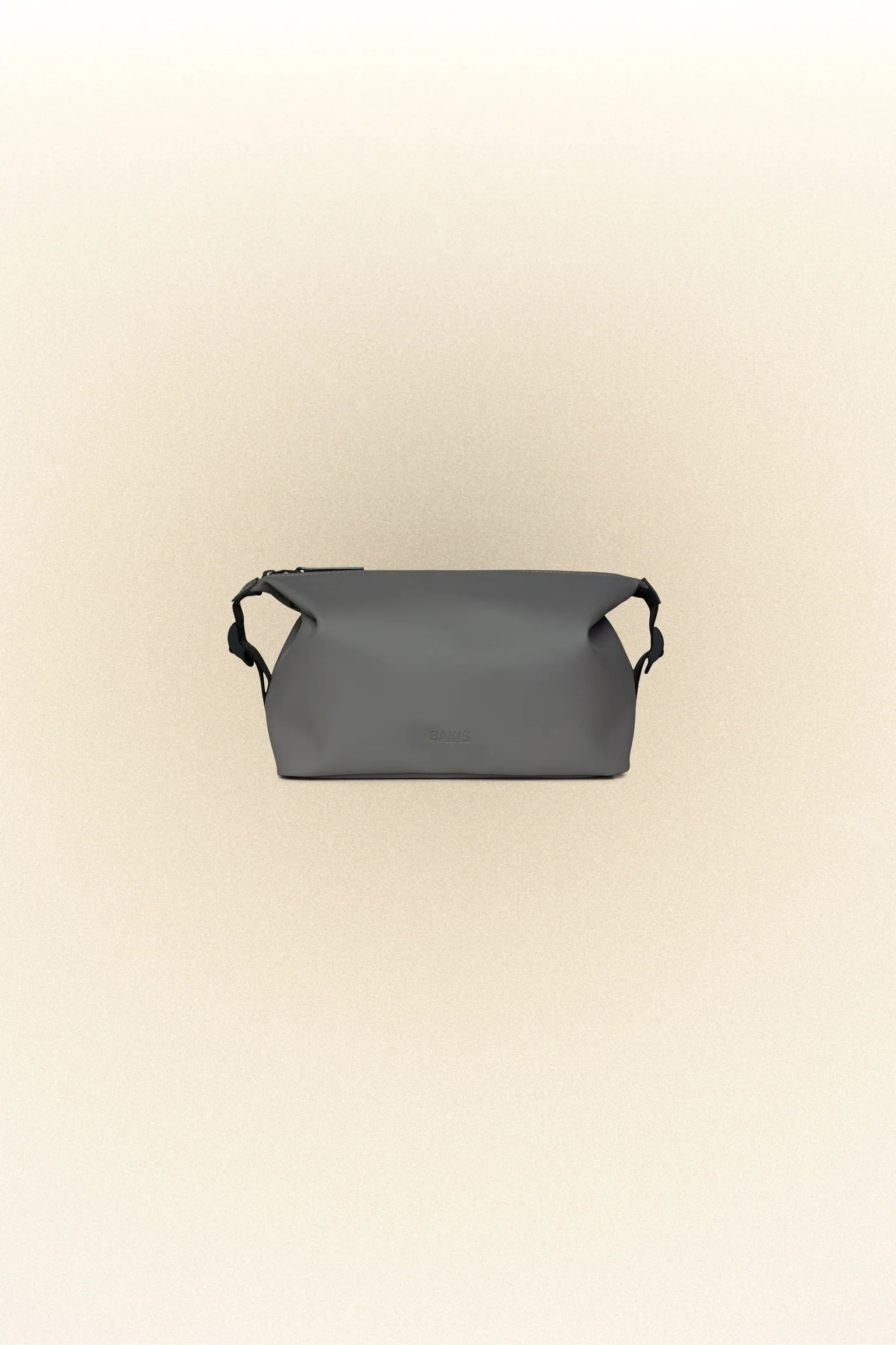 The Rains Hilo Wash Bag, a waterproof design, showcased in an image featuring a grey toiletry bag on a white background.