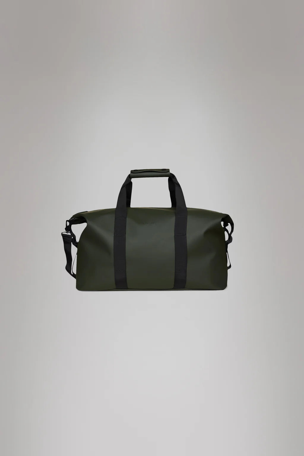 The Hilo Weekend Bag - Green by Rains is a cylindrical dark green duffel featuring black straps and a detachable shoulder strap, made from waterproof Rains PU fabric, displayed against a plain gray background.