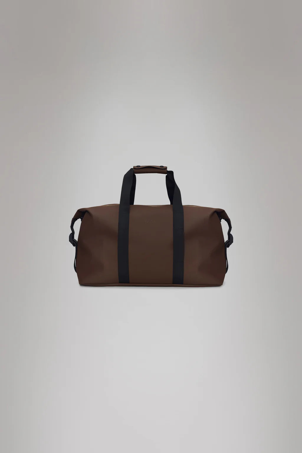 The Hilo Weekend Bag - Frame by Rains, made from their signature PU fabric, includes black handles and a strap. Ideal as a waterproof overnight bag, it is displayed against a neutral background for an elegant appearance.