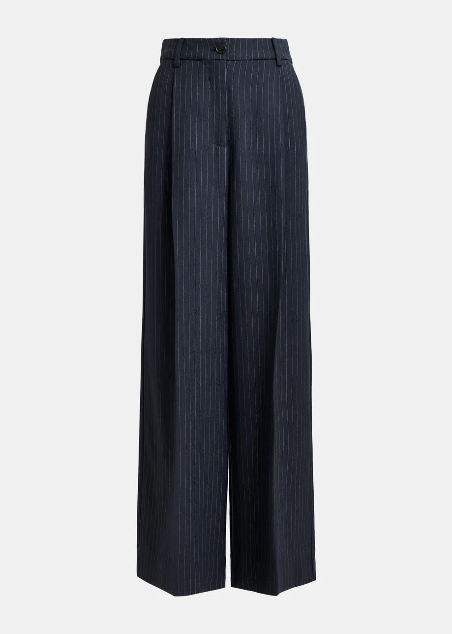 Essentiel Antwerp Invest Wide-Leg Trousers in navy pinstripe feature a high waist, belt loops, front button closure, and two side pockets, shown against a plain white background.