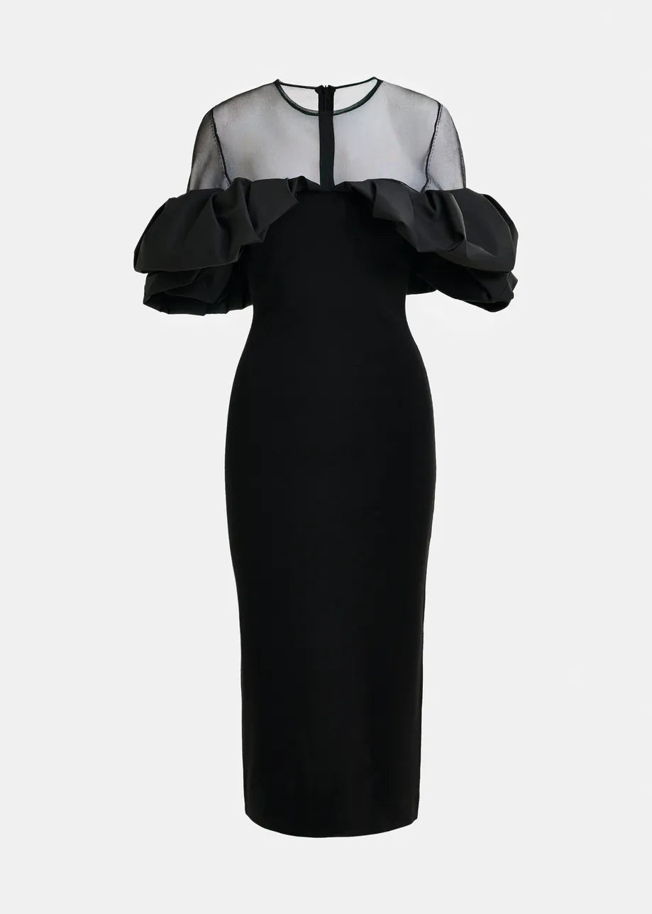 The Isatis Ruffle Dress by Essentiel Antwerp features a black ribbed midi design with a sheer mesh yoke, ruffled off-the-shoulder sleeves, and a fitted silhouette—perfect for your next evening out.