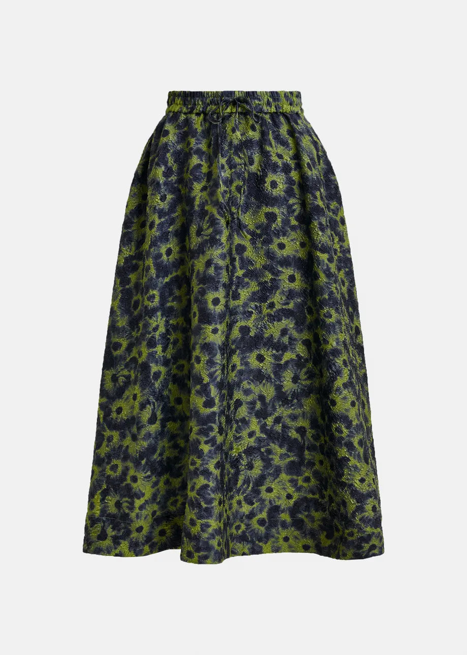 The Isebel Floral Jacquard Skirt by Essentiel Antwerp is an A-line, high-rise skirt with an elastic waistband and a khaki floral pattern.