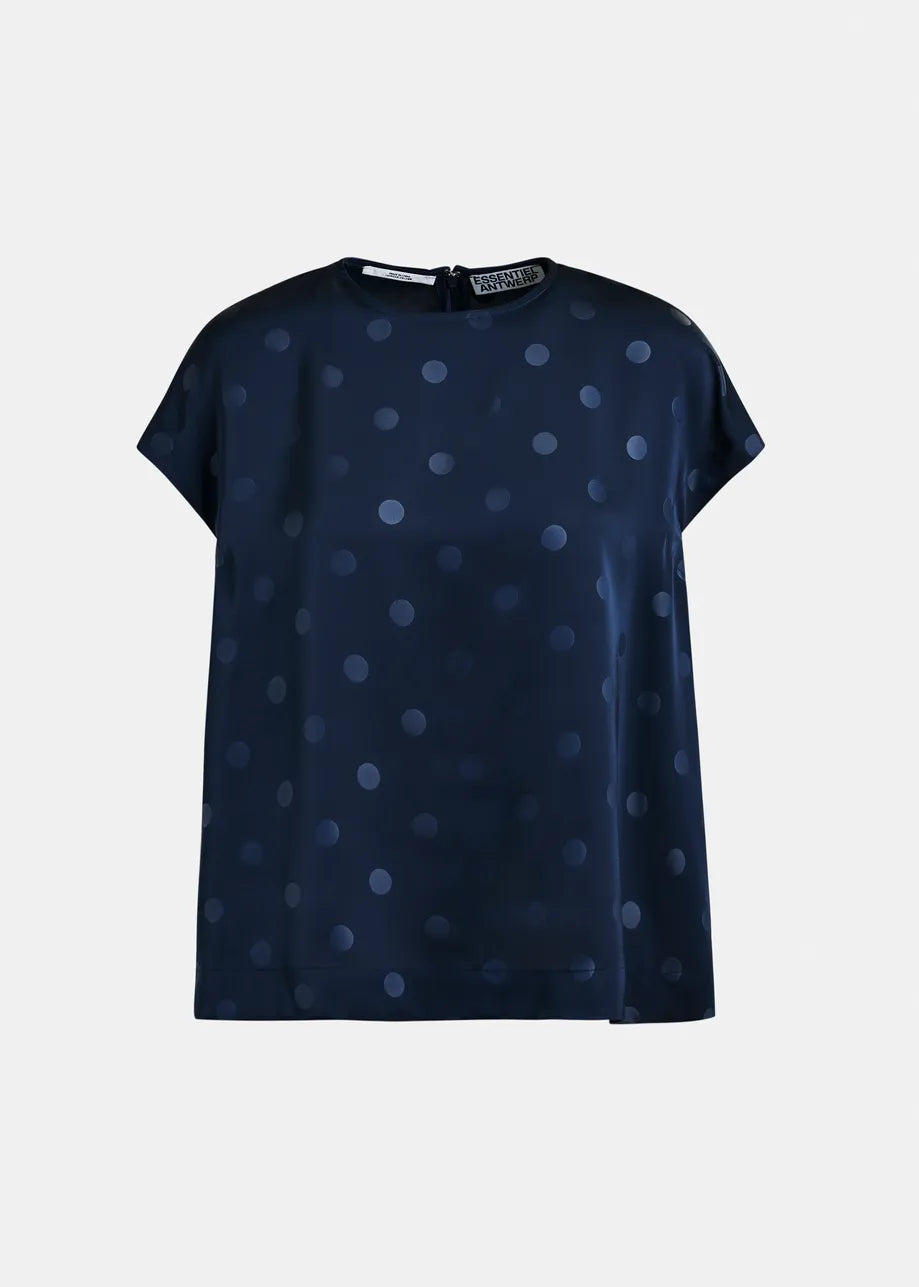 The Essentiel Antwerp Ishirt Polkadot Top - Navy features a relaxed fit, cap sleeves, round neck, and lighter blue polka dots, shown against a plain background.