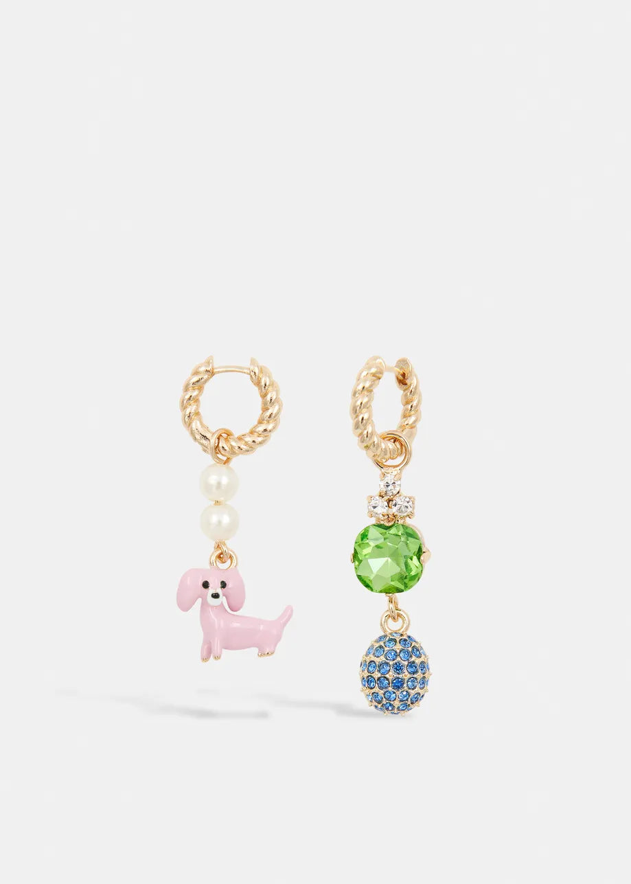 Essentiel Antwerp's Gold Drop Earrings - Pink Dachshund: playful mismatched gold hoops—one with white pearls and a pink dachshund charm, the other with a green gem and blue crystal-studded sphere—for a bold, unique look.