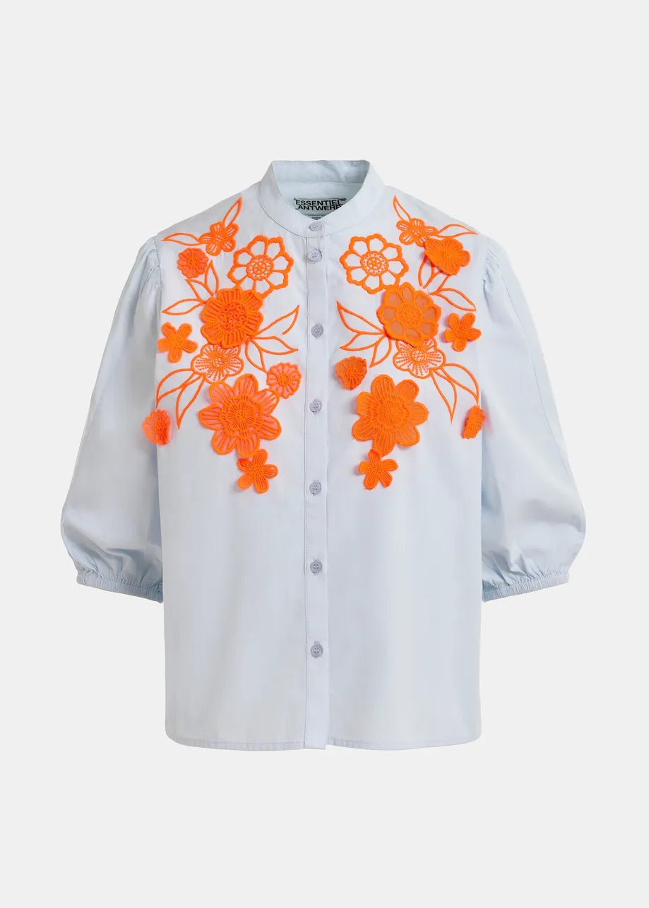 The Jorja Flower Shirt by Essentiel Antwerp features light blue cotton, puffed half sleeves, a mandarin collar, and bright orange floral embroidery on the front.