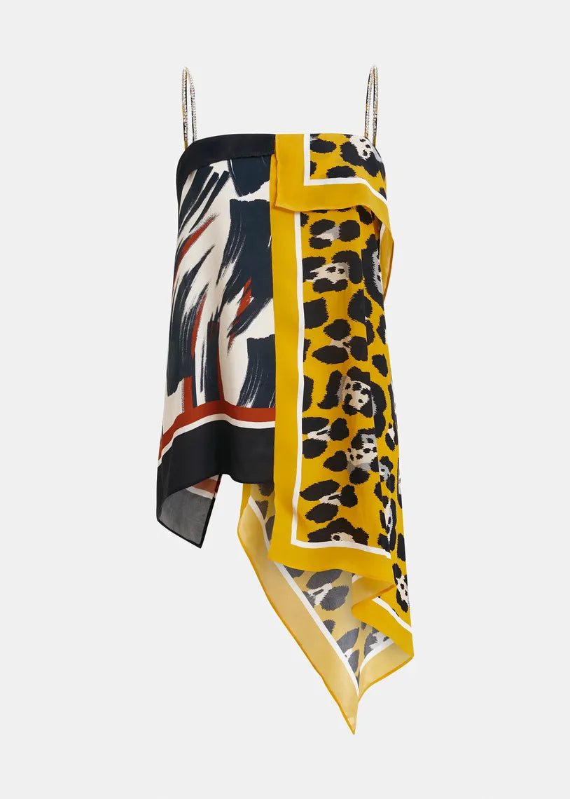 The Josette Two Print Slip Top by Essentiel Antwerp features an asymmetrical handkerchief hem, thin straps, and layered, uneven edges in abstract brushstroke and yellow leopard prints.