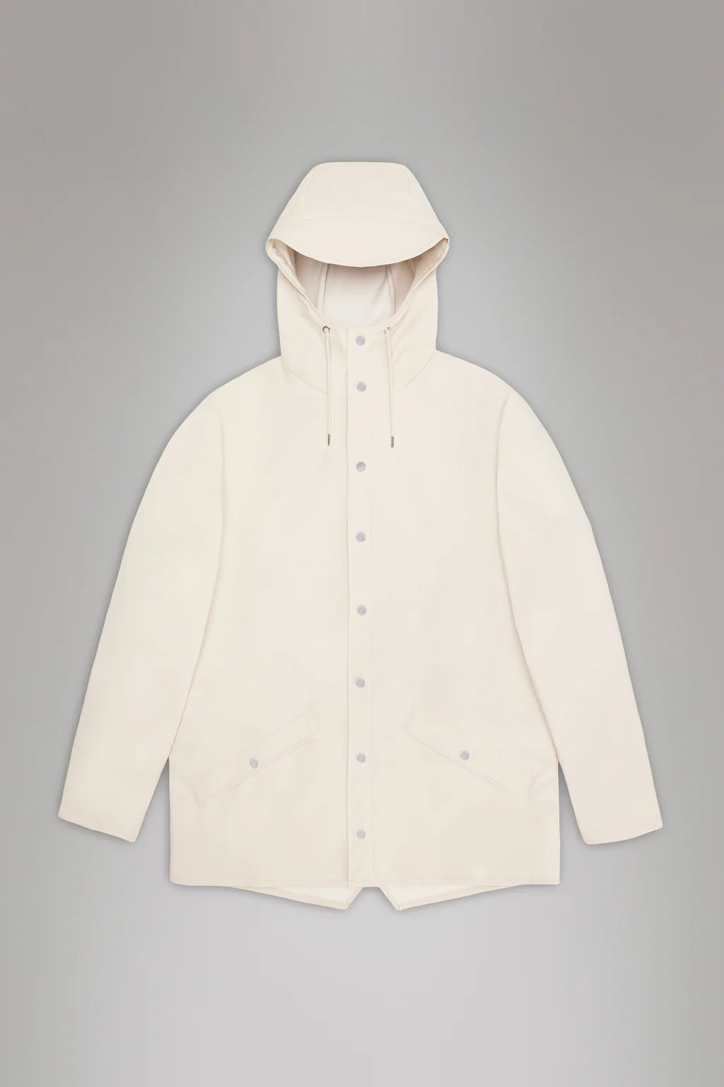 The Rains Jacket W3 is a cream-colored, unisex waterproof jacket featuring a hood, button closure, and front pockets, displayed against a gray background.