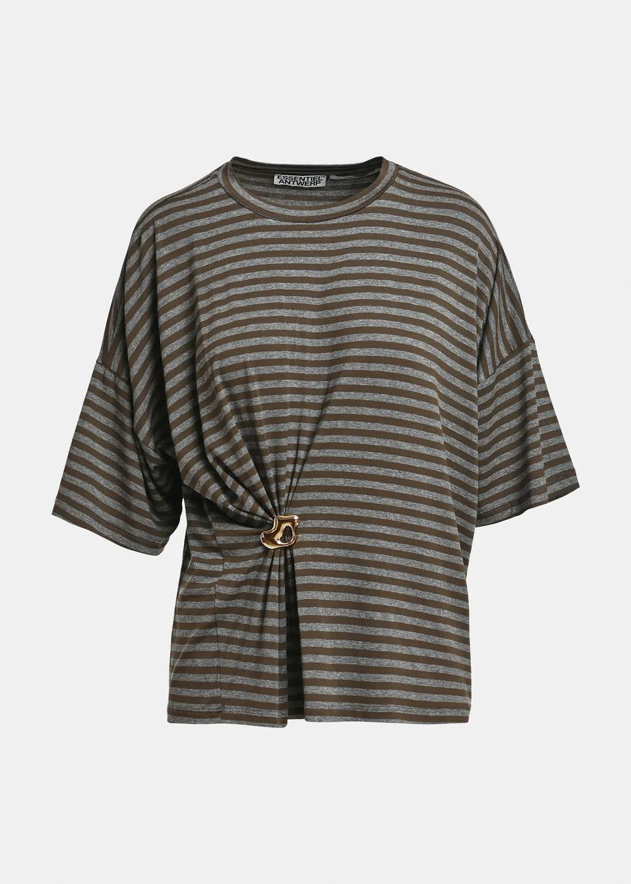 Essentiel Antwerp Kriss Striped T-Shirt with Brooch in khaki features a relaxed, oversized fit with loose short sleeves and gray and black stripes, accented by a side knot detail fastened with a metal ring brooch, photographed on a plain white background.