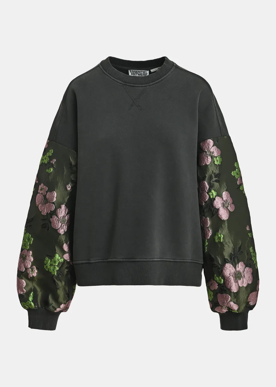 A dark charcoal gray crewneck sweatshirt with long sleeves featuring dark green floral jacquard inserts with pink and green flowers, shown against a light gray background.