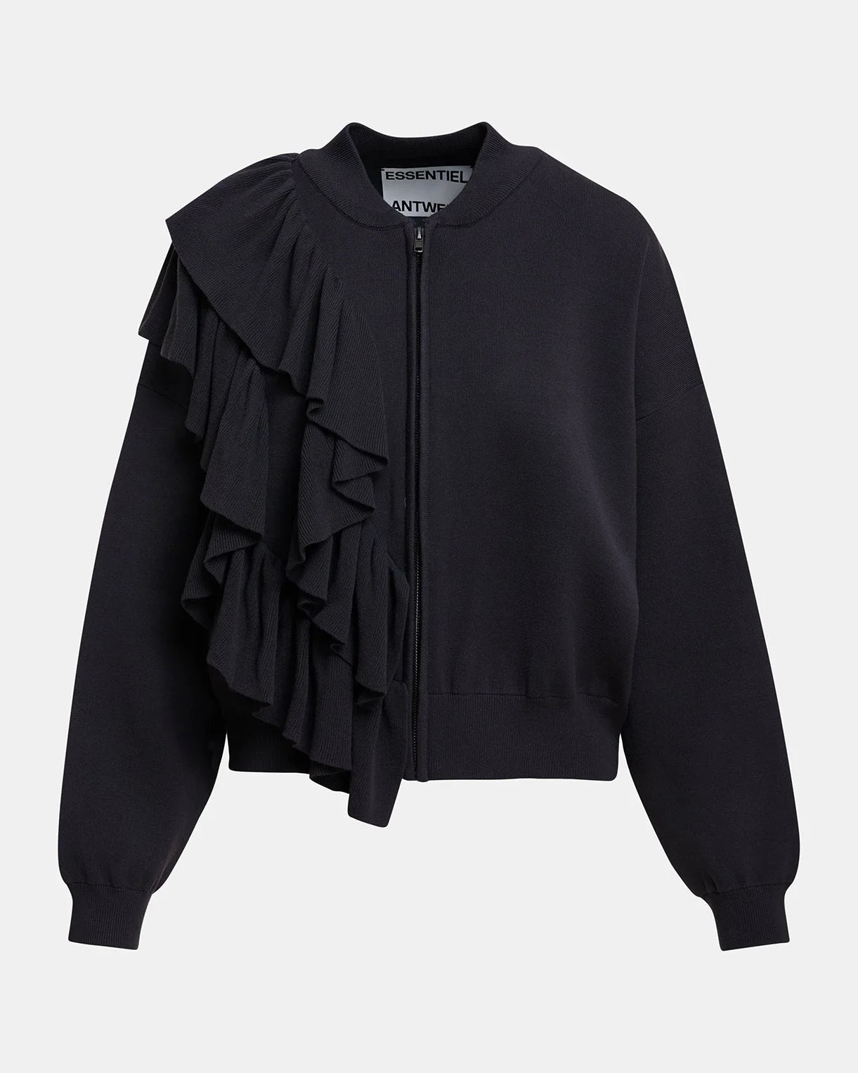 The Kodi Cardigan with Frills by Essentiel Antwerp is a charcoal zip-up jacket with a relaxed fit, round collar, ribbed cuffs, and layered ruffle detailing on the left shoulder and chest.