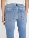 person wears le garcon in galeston by Frame Denim styled with black strappy high sandals, white blouse, back view in a white studio backdrop