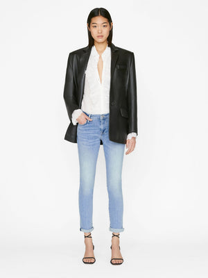 person wears le garcon in galeston by Frame Denim styled with black strappy high sandals, white blouse and a black leather blazer, front view in a white studio backdrop