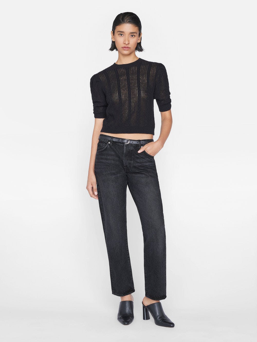 The model is wearing Le Slouch - Pompei black cropped jeans made from sustainable denim, paired with a black sweater.