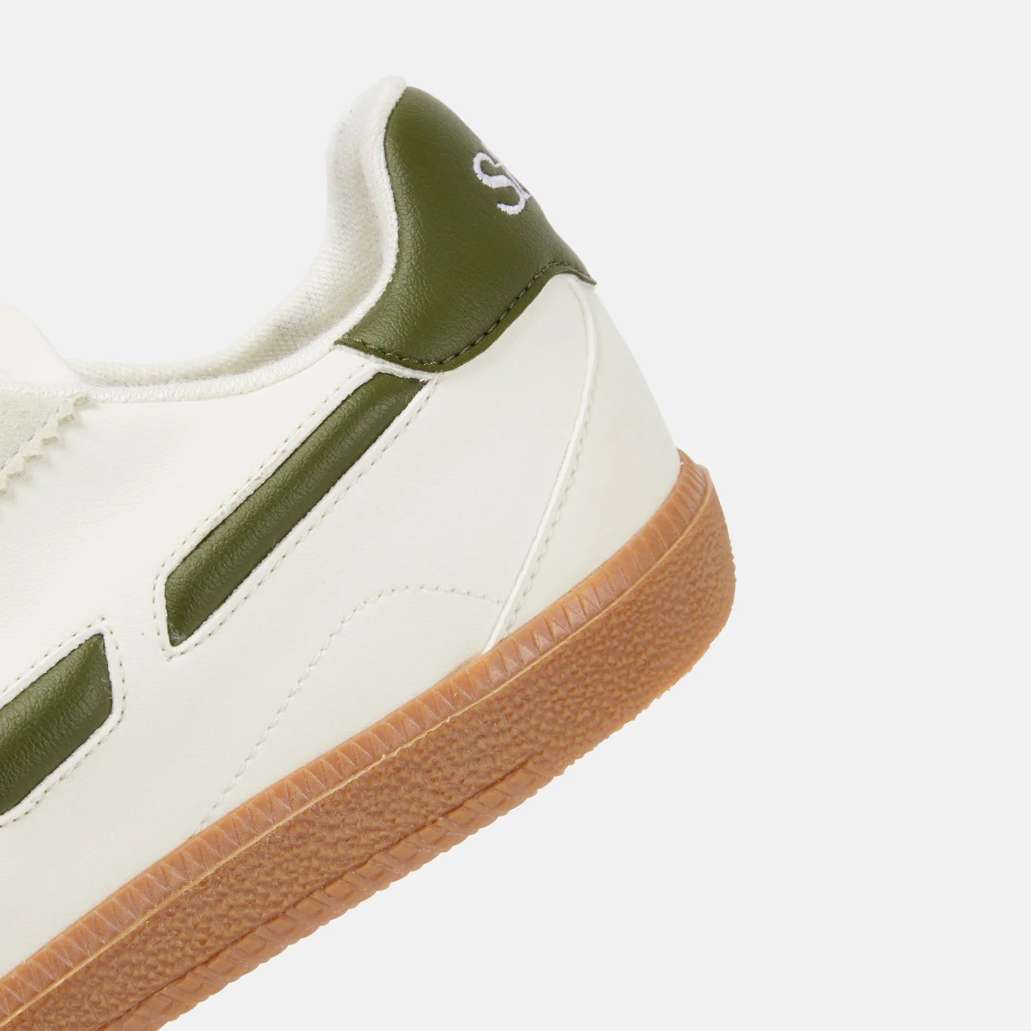 off white sneakers with dark green detail on sides
