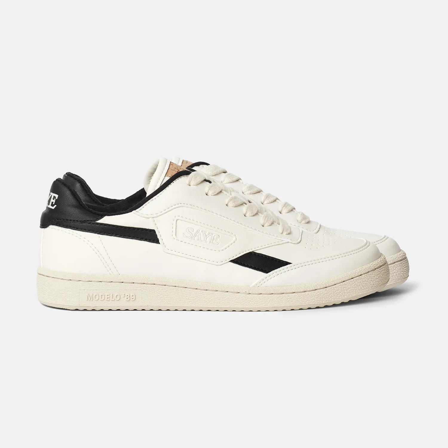 A pair of Modelo '89 sneakers in white with black detailing by SAYE.