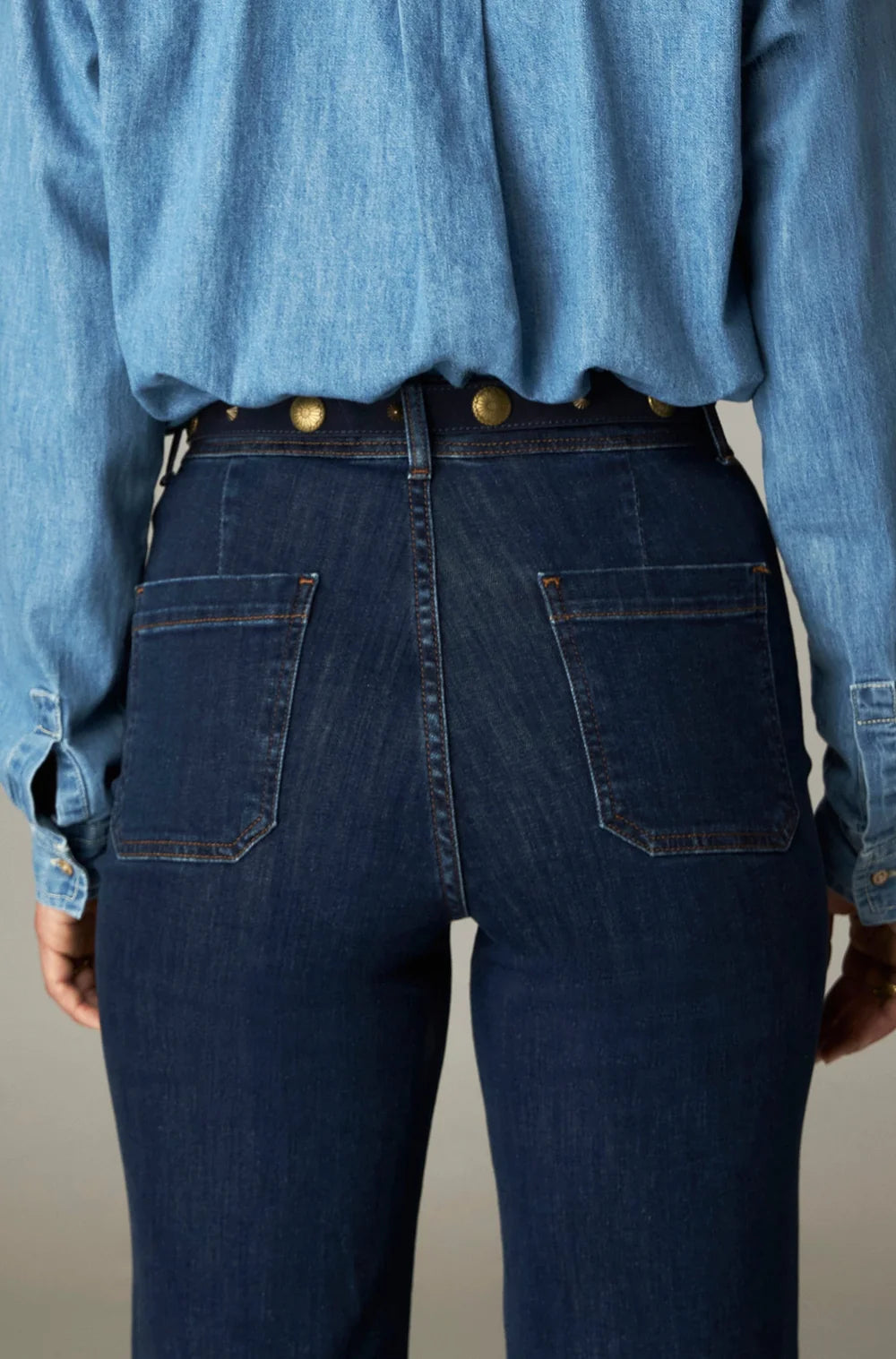 Giulietta Pant - Blue Denim in dark blue high-rise wide-leg denim with back patch pockets and gold-toned metal studs on the waistband.