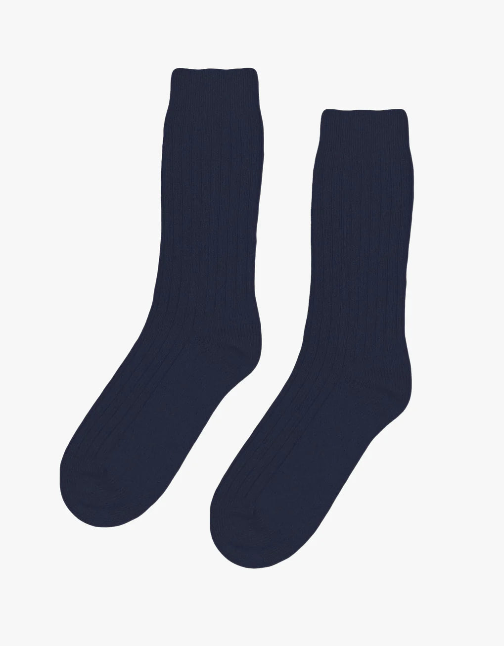 A pair of Colorful Standard Merino Wool Blend Socks on a white background made from recycled fibres.