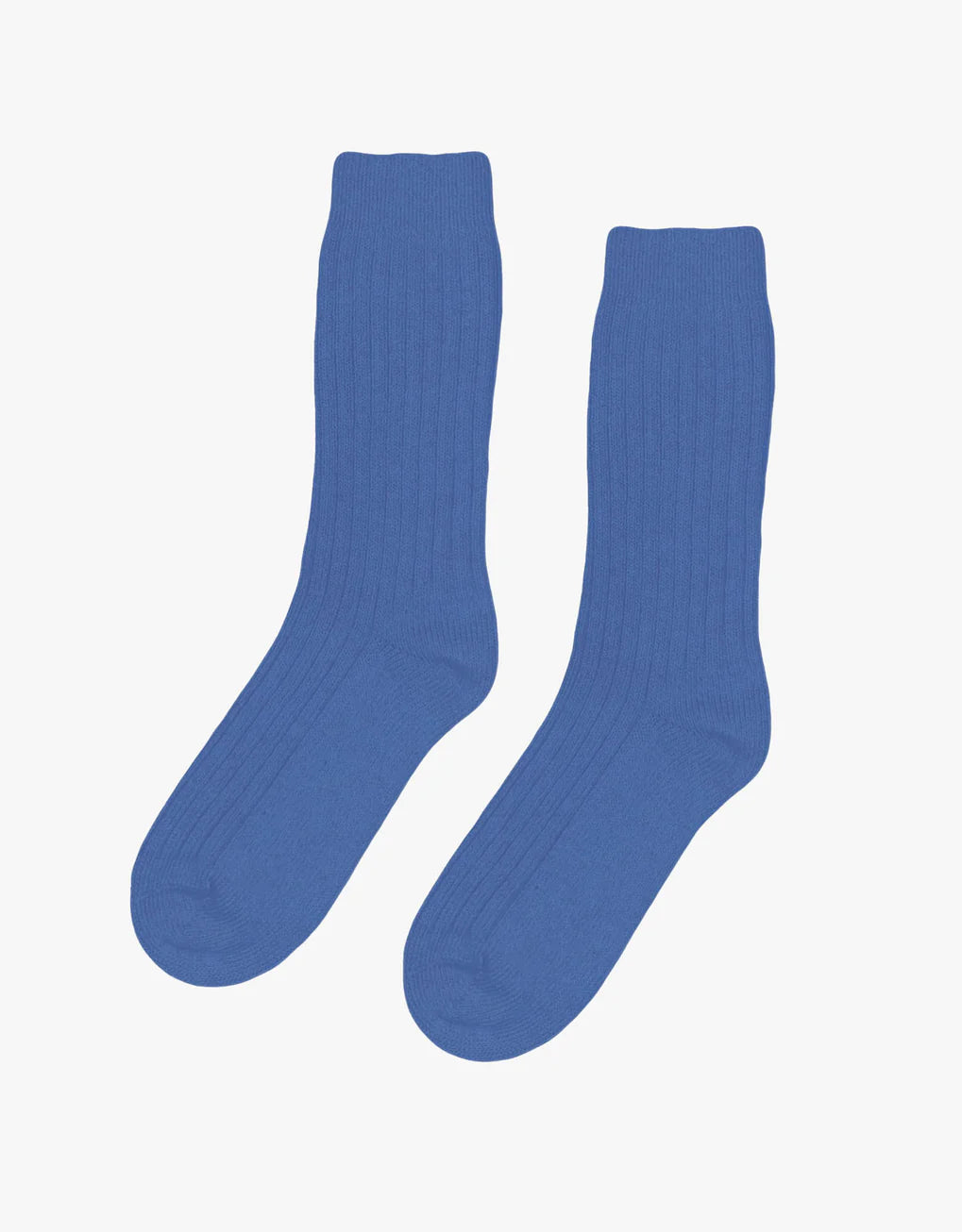 A pair of Colorful Standard Merino Wool Blend Socks made from recycled fibers on a white background.