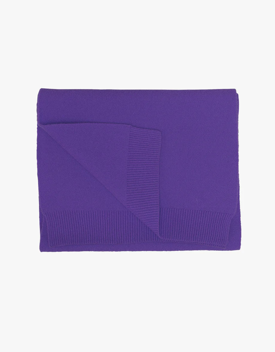 A luxurious Colorful Standard merino wool scarf on a white background.