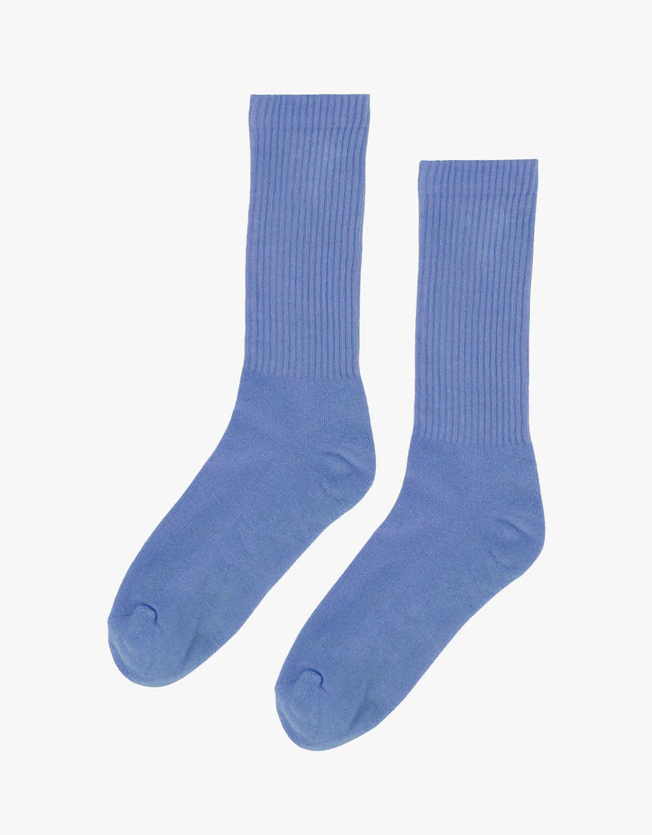 A pair of Colorful Standard blue Organic Active Socks on a white background.