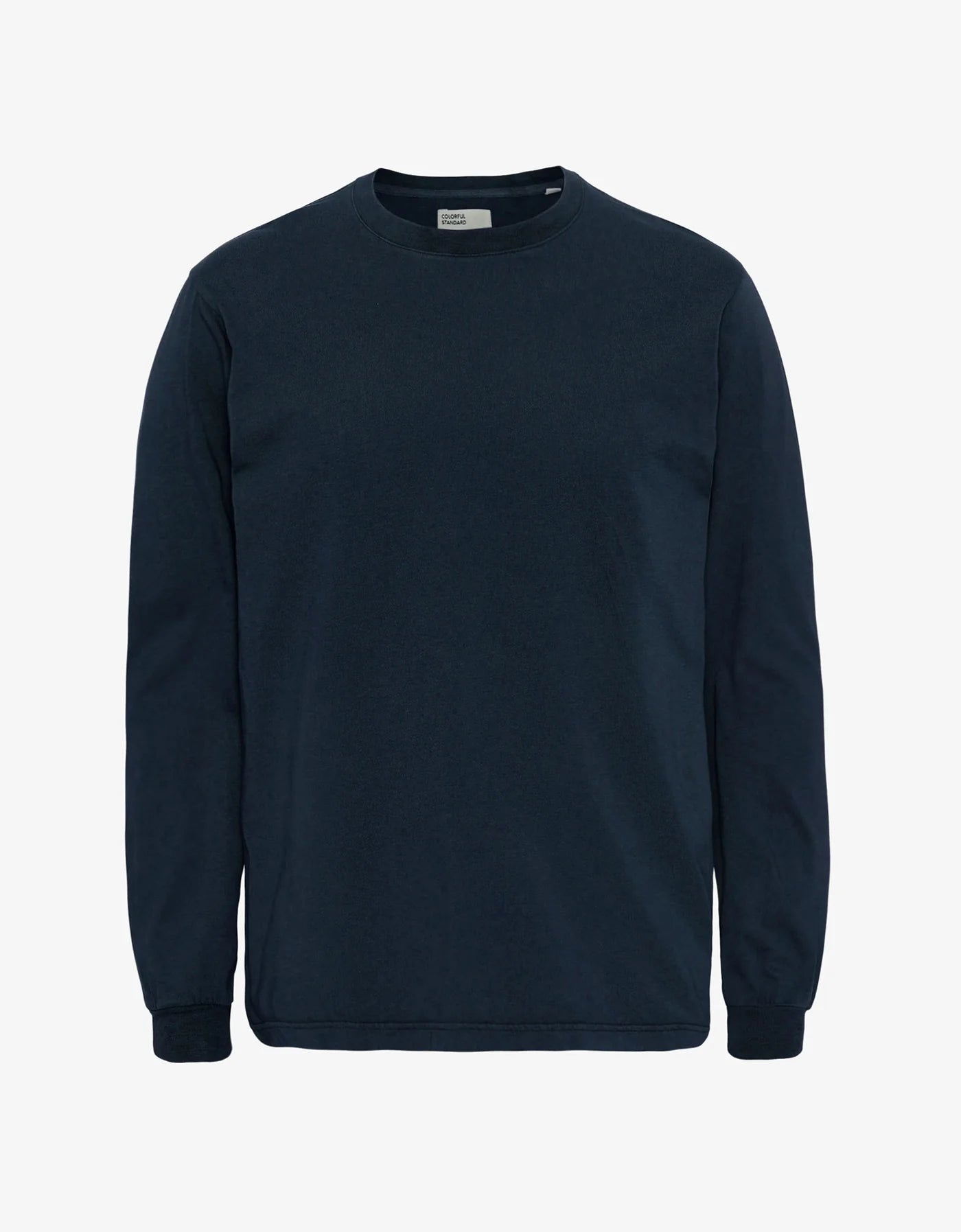 The Colorful Standard Organic Oversized Long Sleeve T-Shirt features a plain design with long sleeves, a crew neck, and is crafted from organic cotton in dark navy blue; it is displayed against a white background.