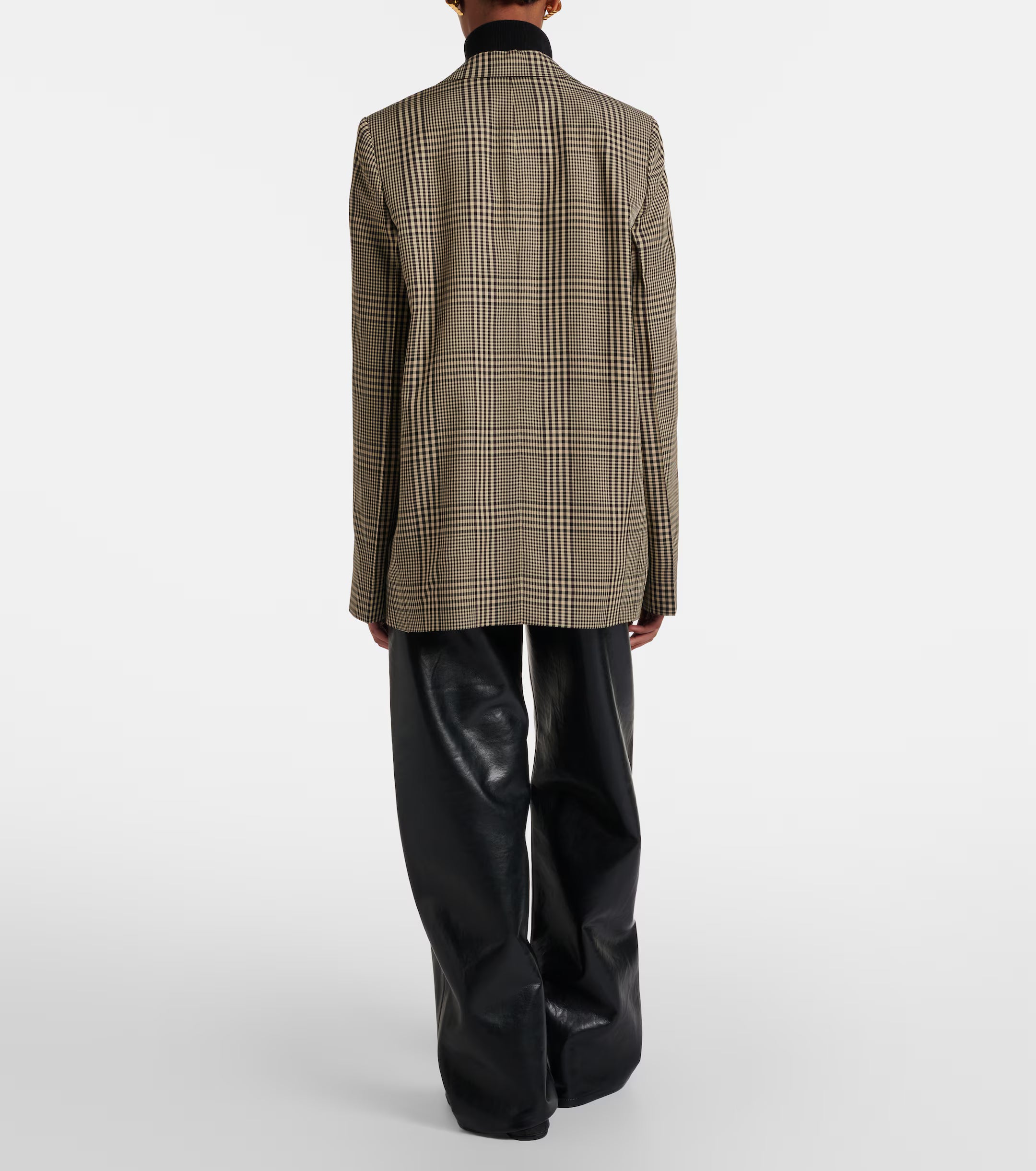 A person stands with their back to the camera, wearing a plaid blazer and the AGOLDE Arc Jean 32 Wide Leg Trousers - Detox, inspired by the iconic Arc Jean silhouette, set against a plain white background.