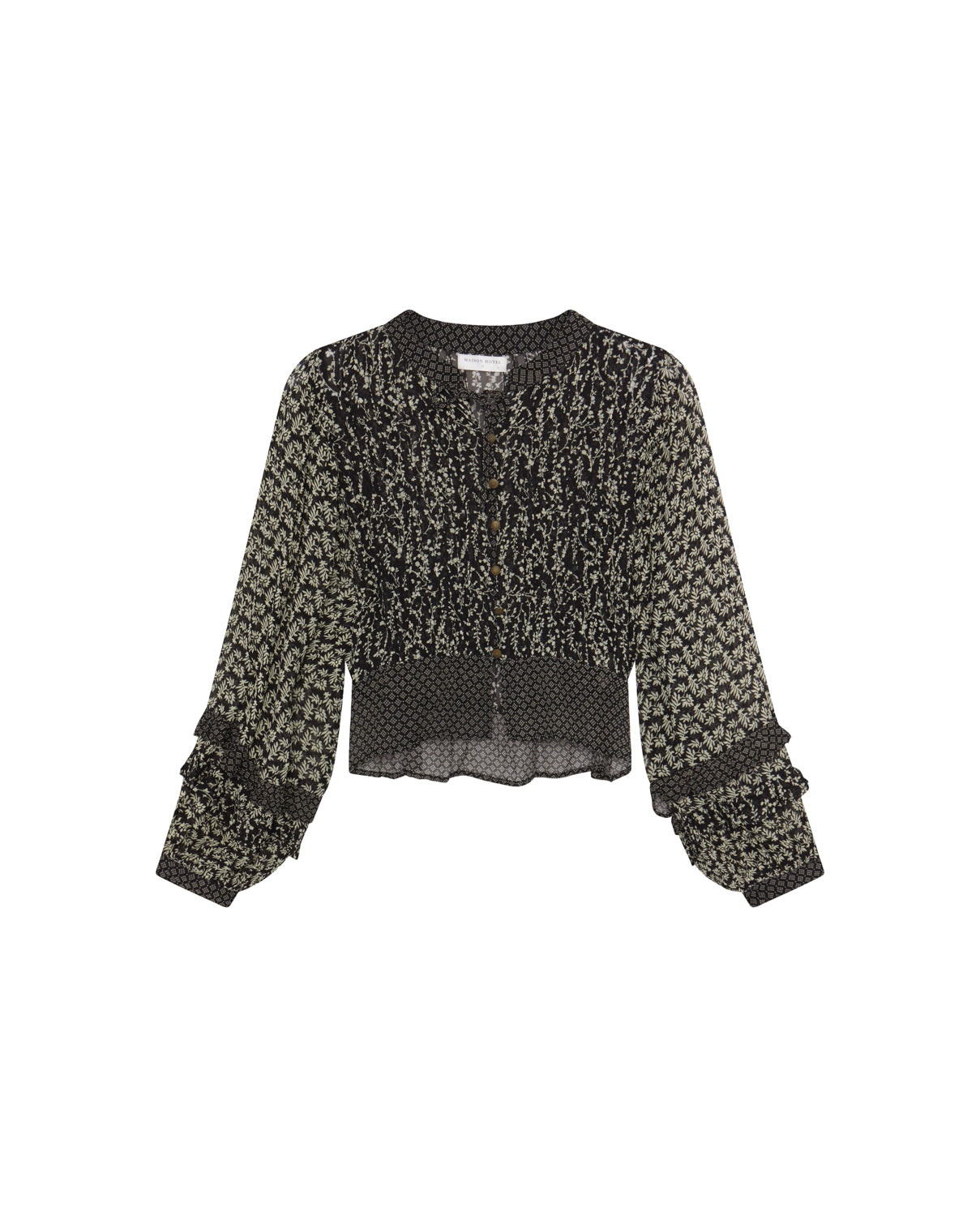 The Catalina Blouse – Black Sheep by Maison Hotel features black long sleeves, a small floral print, smocked cuffs, round neckline, and a cropped flowy hem in lightweight fabric.