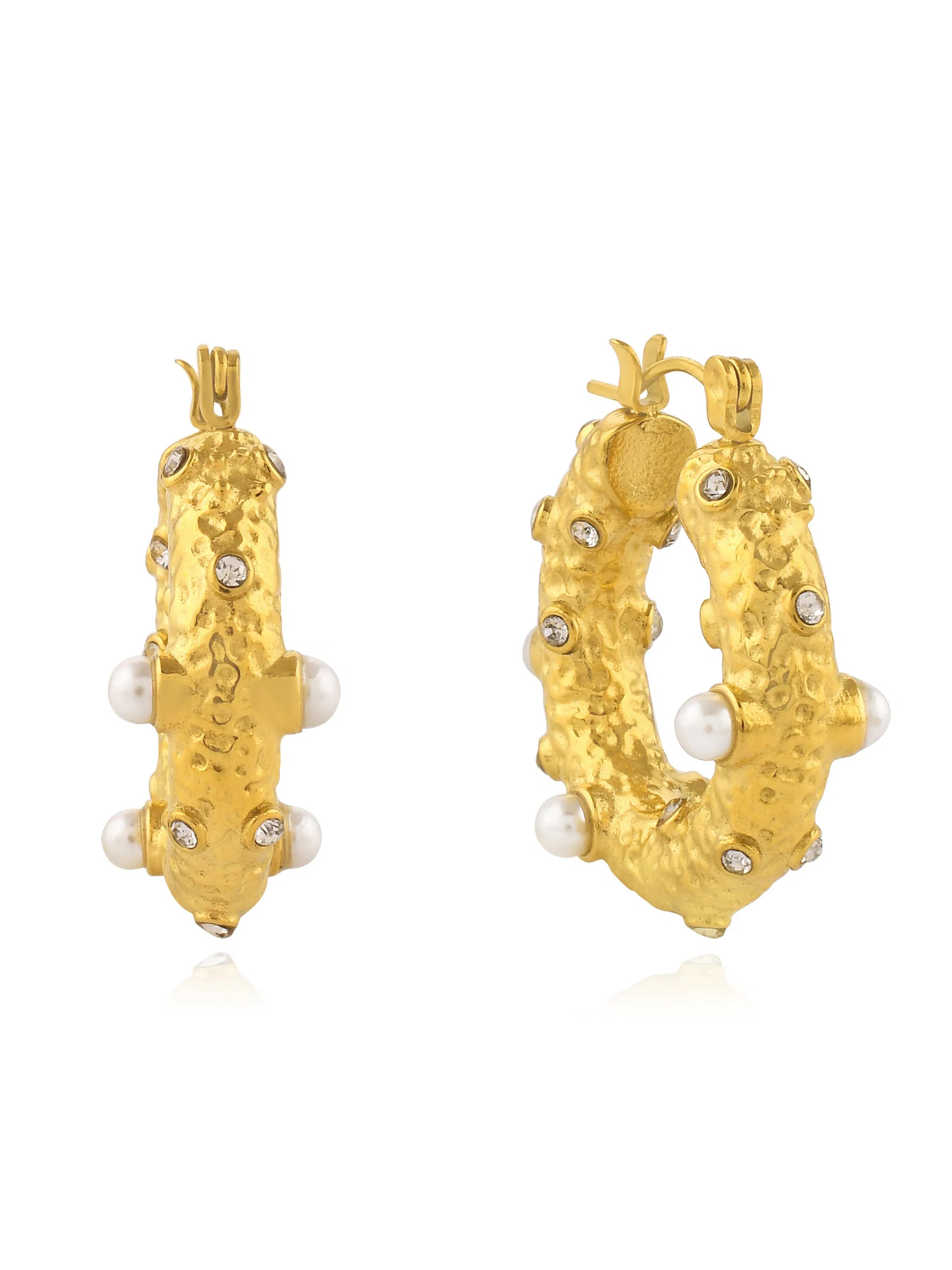 A pair of Shyla yellow gold hoop earrings with pearls.