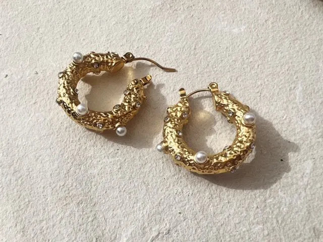 A pair of SHYLA - Sirius Hoops- Gold earrings with gold pearls by Shyla.