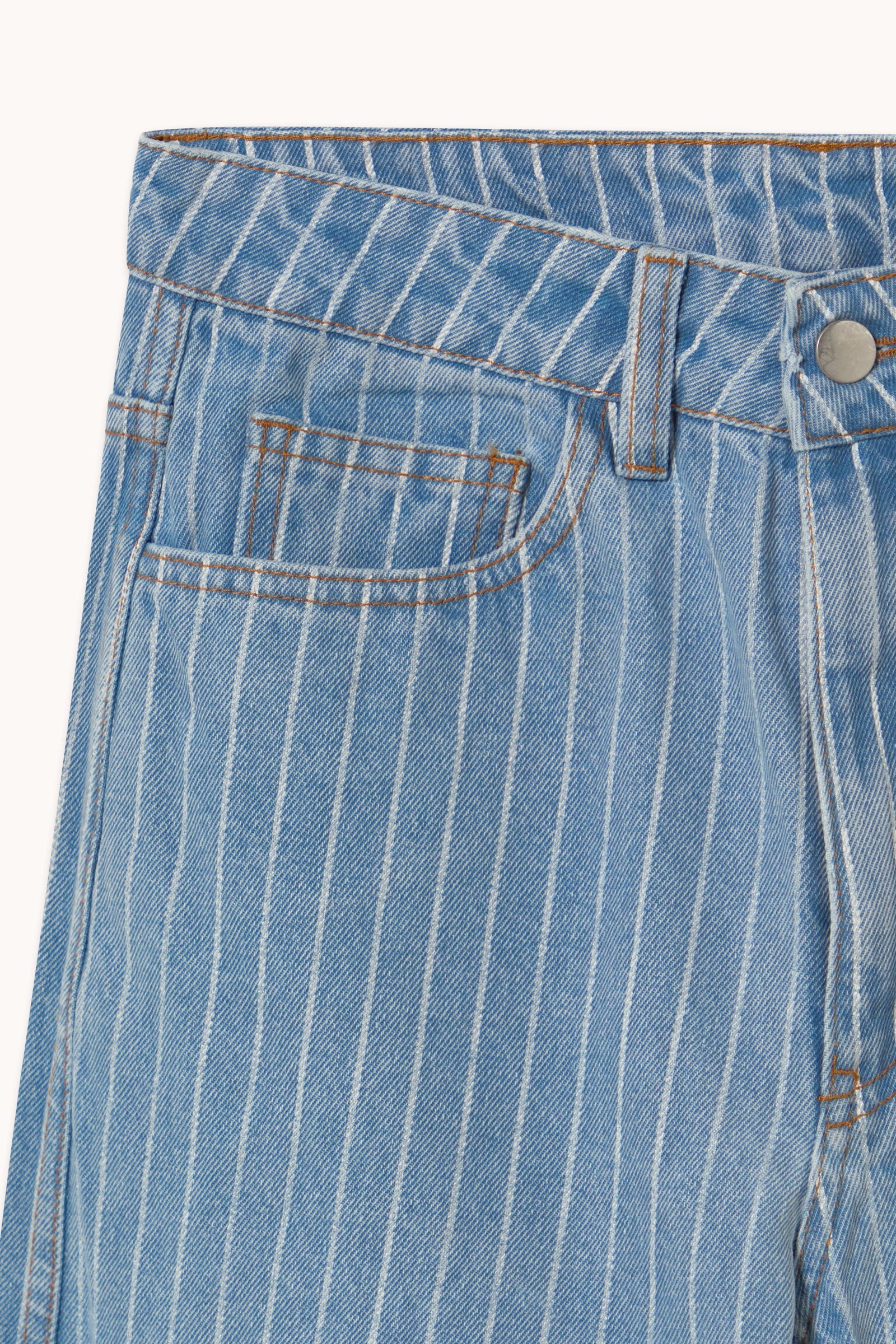 Close-up of Tiny Big Sister's Berta Wide Leg Jeans in Blue Stripe, featuring a high waist, front pocket, belt loops, and an exposed metal button at the waistband.