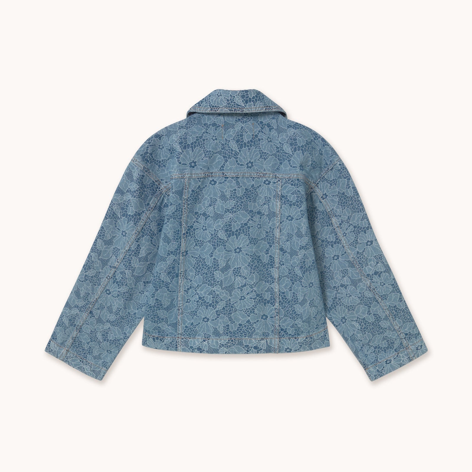 Blue denim jacket with floral pattern on a white background