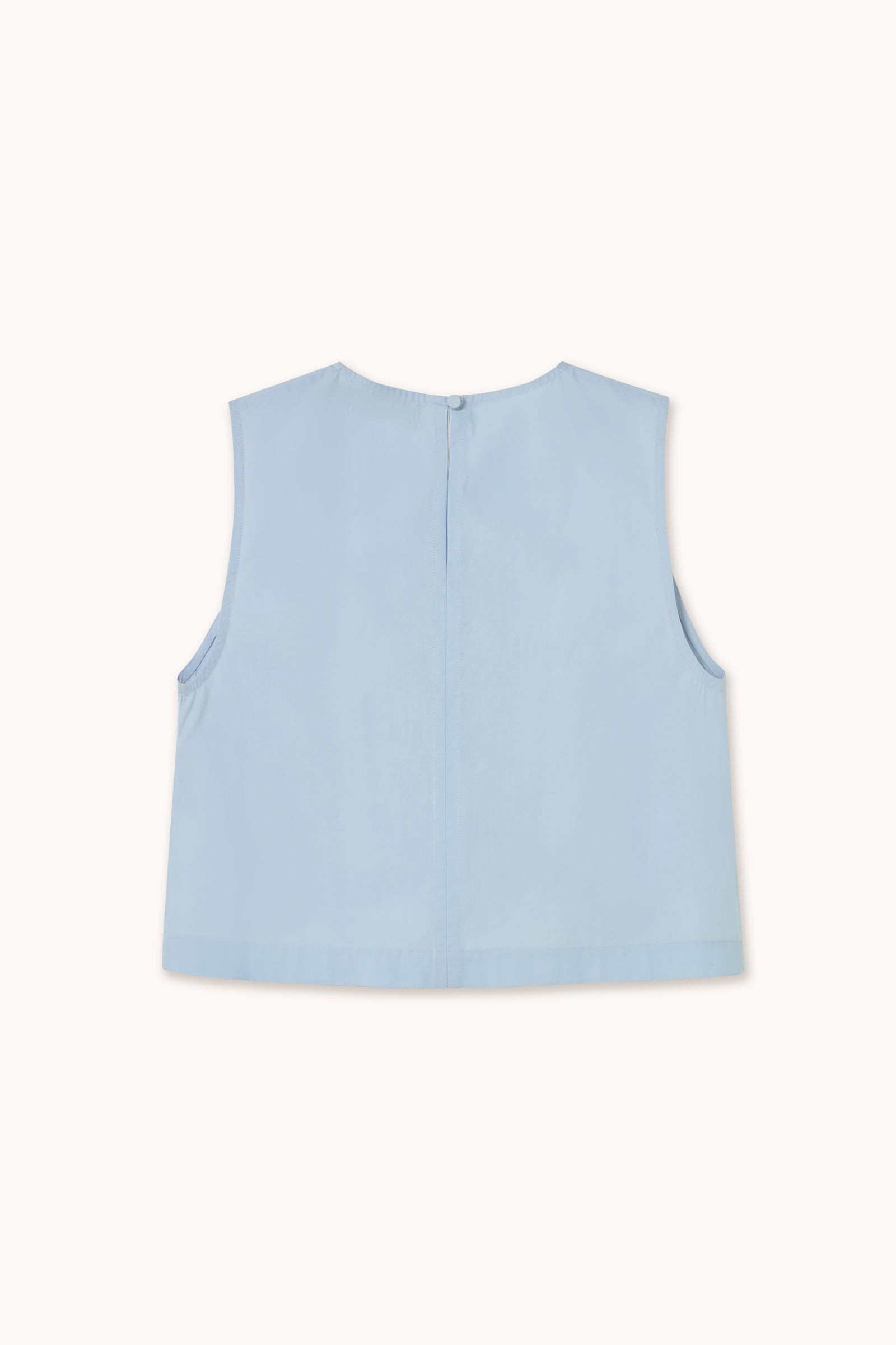 The Embroidered Sleeveless Top - Blue by Tiny Big Sister features soft cotton, a back button closure, and delicate floral embroidery for a charming finish.