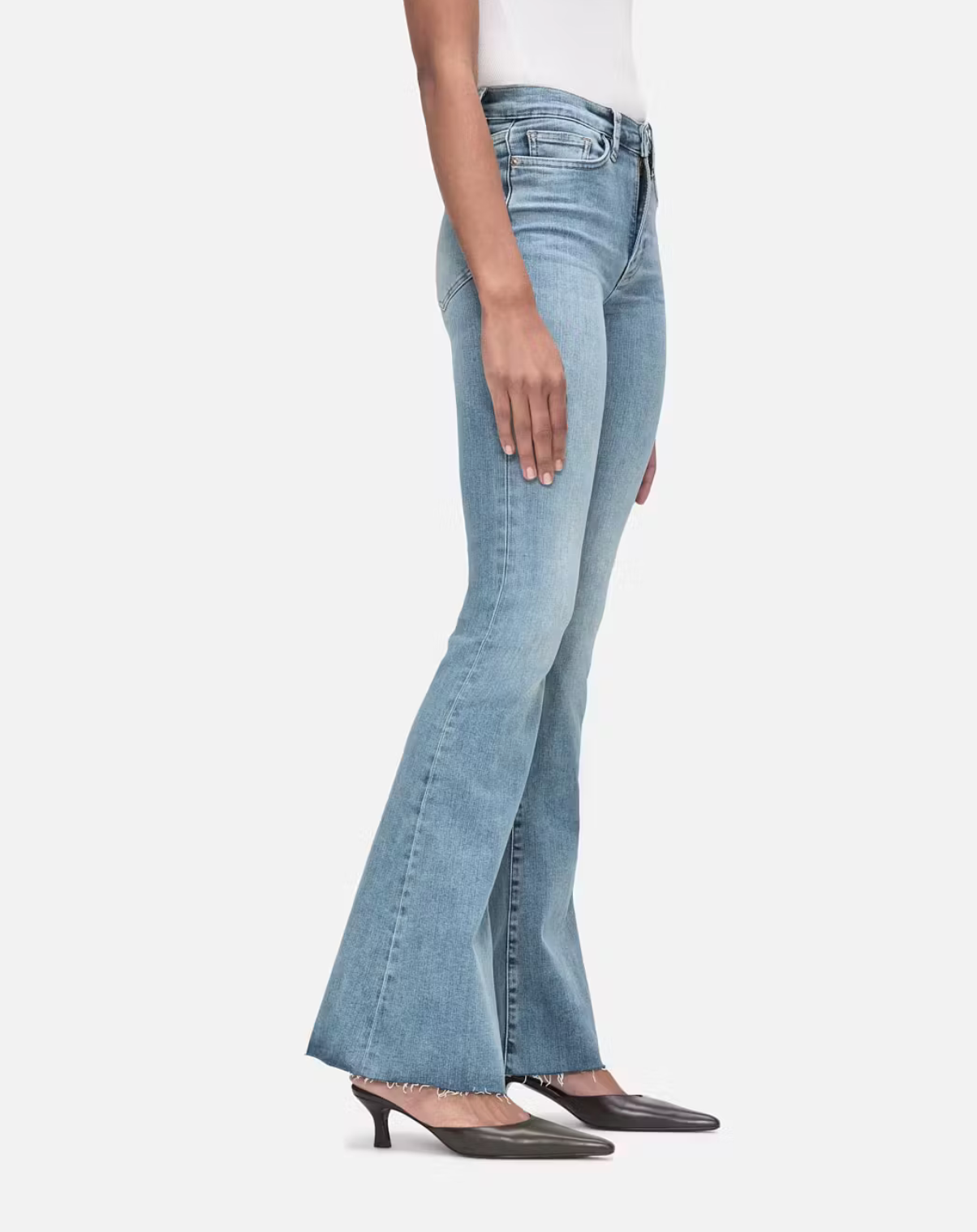 A woman wearing a pair of Frame Le Easy Flare - Colorado high-rise waist, flared jeans.