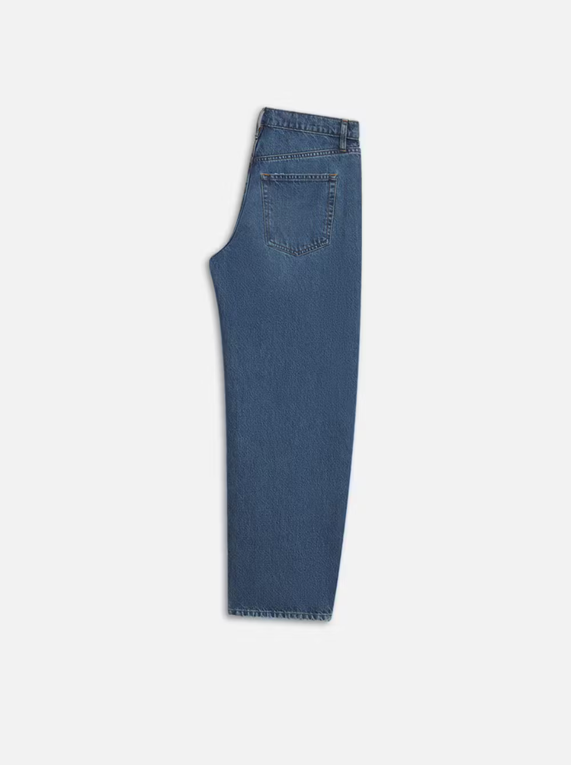 A pair of FRAME Long Barrel Leg - Caramia jeans displayed flat, showcasing the side with a visible pocket, waistband, and seam stitching against a plain white background, highlighting the sustainable denim craftsmanship.