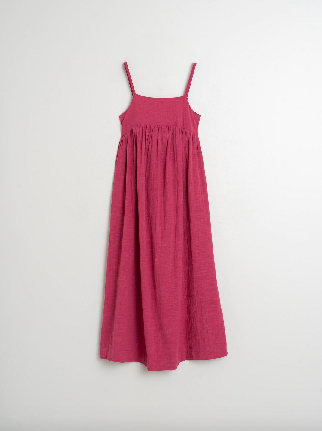 Indi & Cold's Maxi Dress with Straps in Rose, a long pink sleeveless dress, is elegantly displayed against a plain white background.