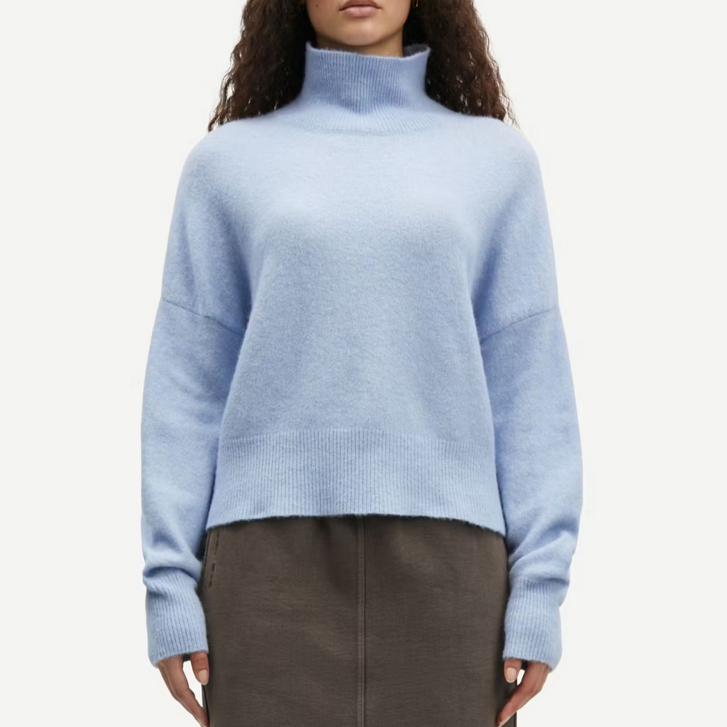 model wears samsoe samsoe light blue high neck wool knitted sweater