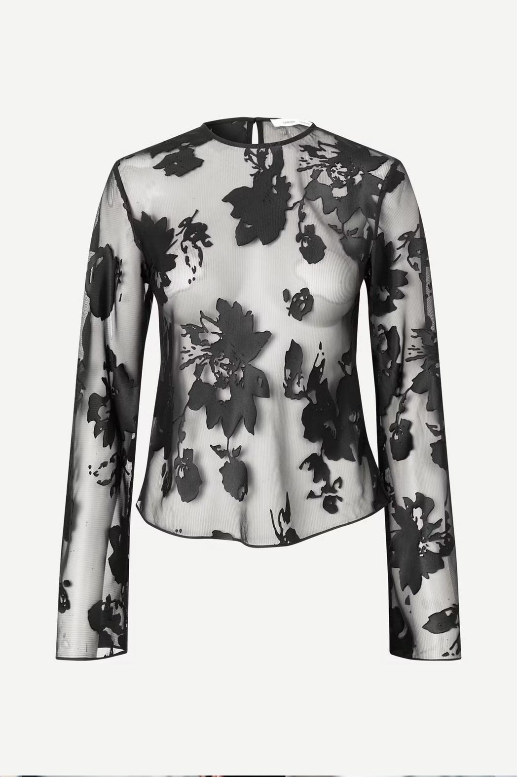 The Samadda Blouse - Black Burnout by Samsøe Samsøe is a black and white sheer blouse with a floral pattern, featuring long sleeves, a round neckline, and back button closure.