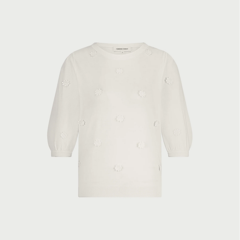 a sweater called hilly by fabienne chapot in white with floral embroidered details on a white background