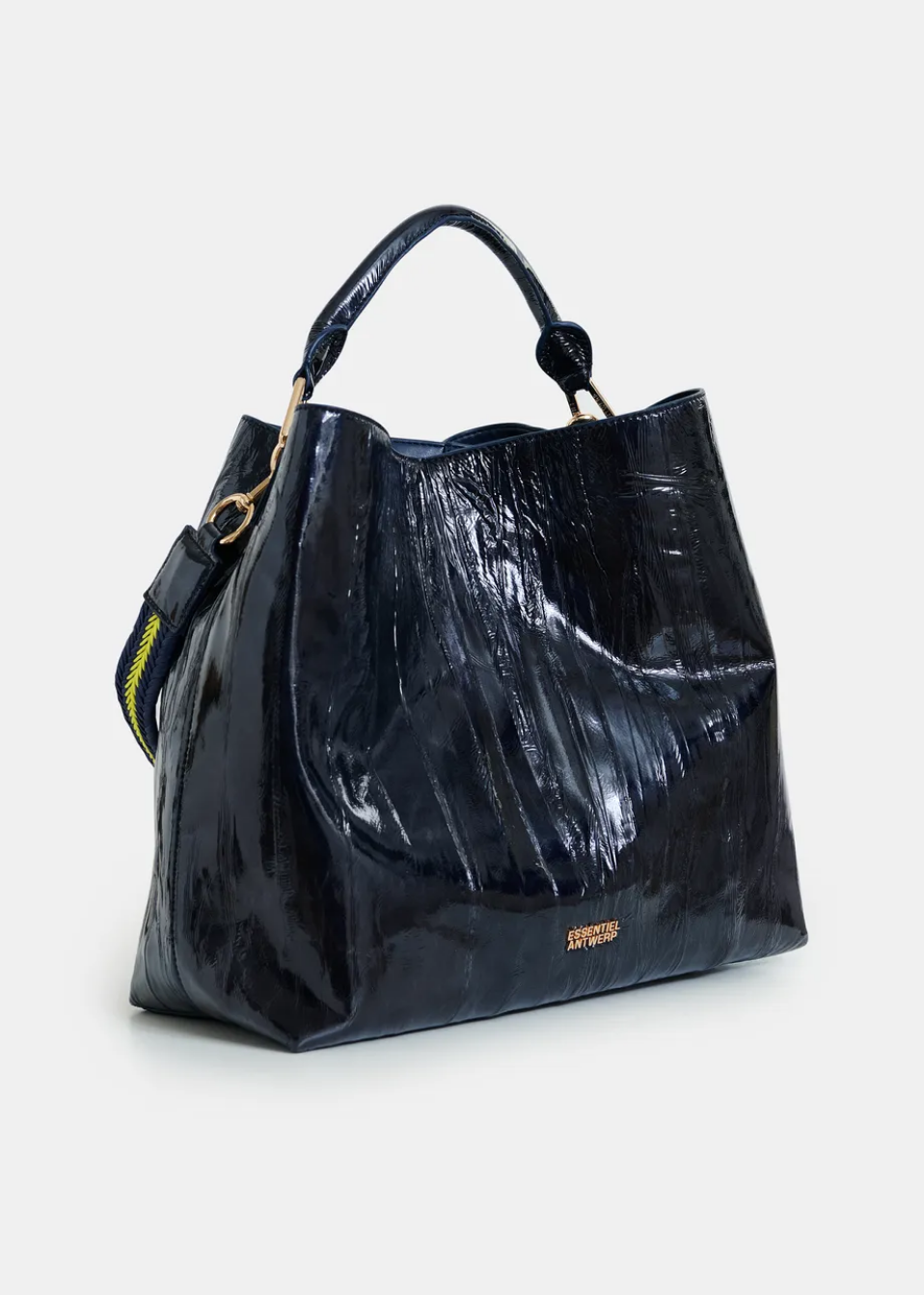 Essentiel Antwerp navy patent faux-leather JISTALO shopper handbag with a yellow strap on a white background
