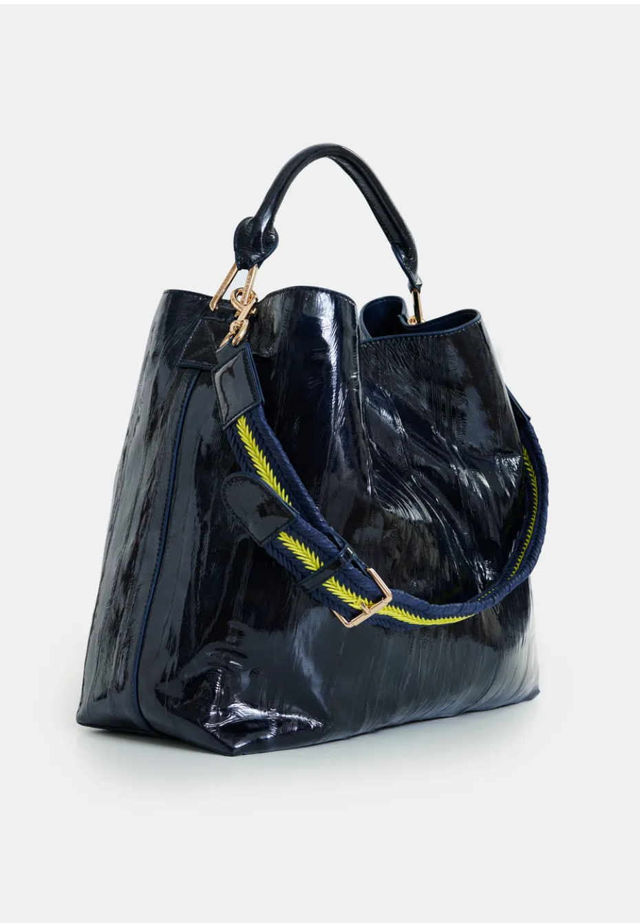 Essentiel Antwerp navy patent faux-leather JISTALO shopper handbag with a yellow strap on a white background