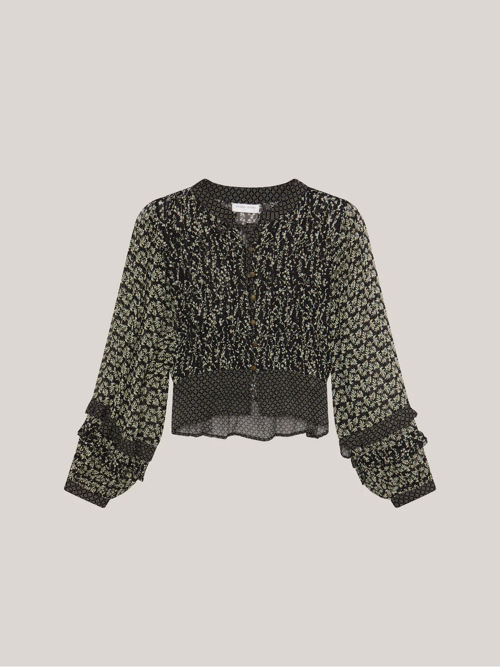 The Catalina Blouse – Black Sheep by Maison Hotel features a cropped silhouette, long billowing sleeves with ruffled cuffs, a smocked waist, and button-down front in black and green floral, shown on a plain background.